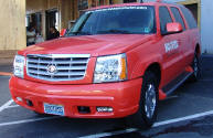front grill of a Cadillac Escalade parked at Hooters