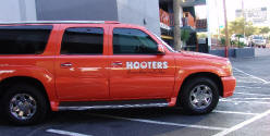 orange Cadillac escalade parked at Hooters hotel and casino in Las Vegas Nevada