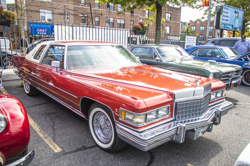 red 1976 Cadillac with white top