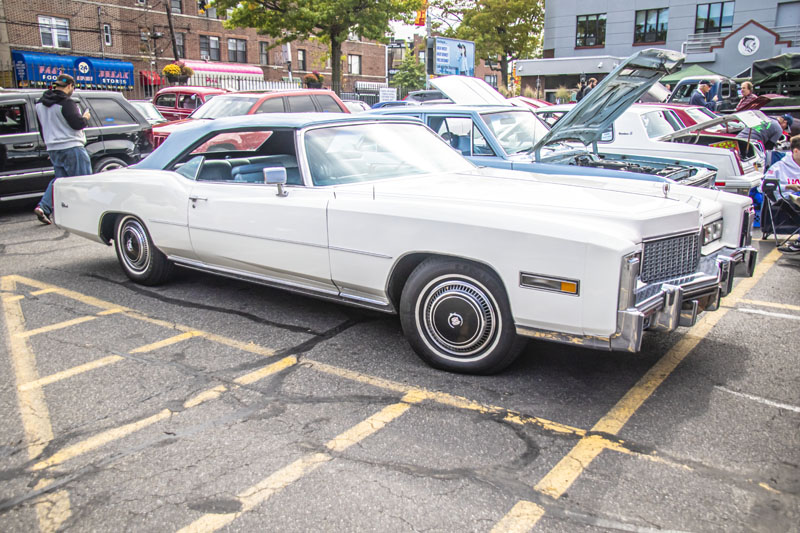 1976 Cadillac convertible with blue roof